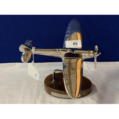 65 - A CHROME MODEL OF A SPITFIRE ON A WOODEN BASE