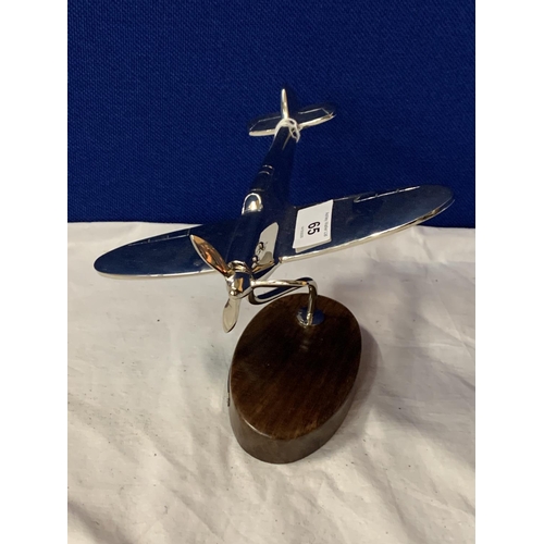 65 - A CHROME MODEL OF A SPITFIRE ON A WOODEN BASE