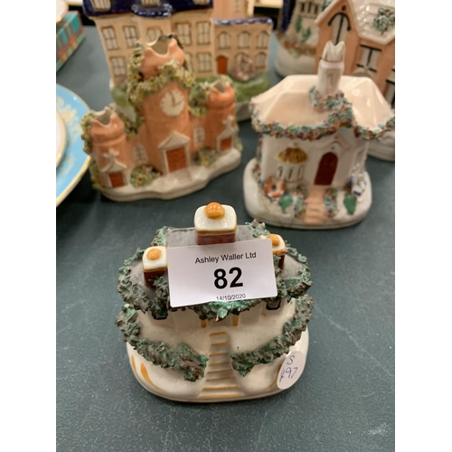 82 - AN ASSORTMENT OF STAFFORDSHIRE STONEWARE IN THE GUISE OF BUILDINGS