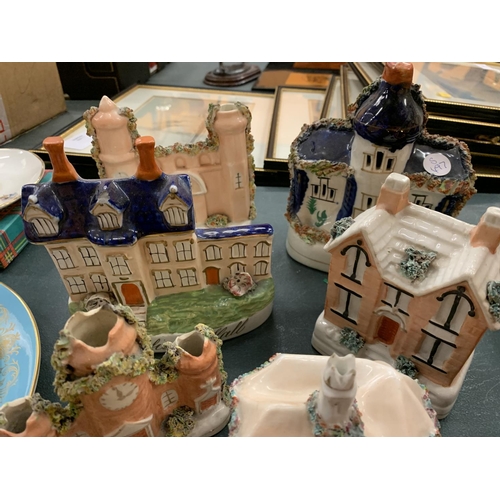 82 - AN ASSORTMENT OF STAFFORDSHIRE STONEWARE IN THE GUISE OF BUILDINGS