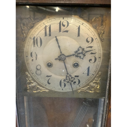 274 - A VINTAGE ORNATE WOODEN WALL CLOCK