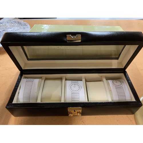 437 - A LEATHER COVERED WATCH BOX WITH FIVE COMPARTMENTS