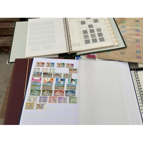 320 - A MIXED LOT OF STAMPS TO INCLUDE FINLAND (MIXED) GUERNSEY, IRELAND, PLUS ONE EMPTY BINDER AND REGION... 