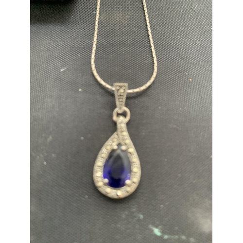 590 - SILVER MARKED BLUE PASTE AND MARCASITE TEARDROP PENDANT AND CHAIN. APPROX TOTAL WEIGHT 5 GRAMS