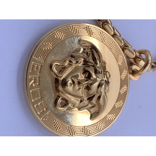 593 - A GOLD PLATED VERSACE MEDALLION WITH CHAIN