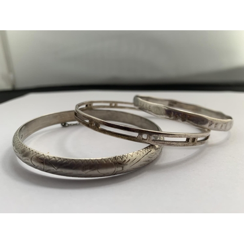 599 - THREE SILVER BANGLES TWO STAMPED 925 AND ONE HALLMARKED