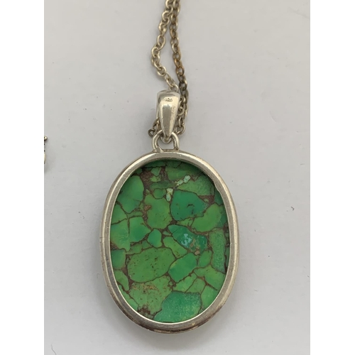 601 - A BOXED STAMPED 925 SILVER MULTI GREEN STONE PENDANT WITH CHAIN