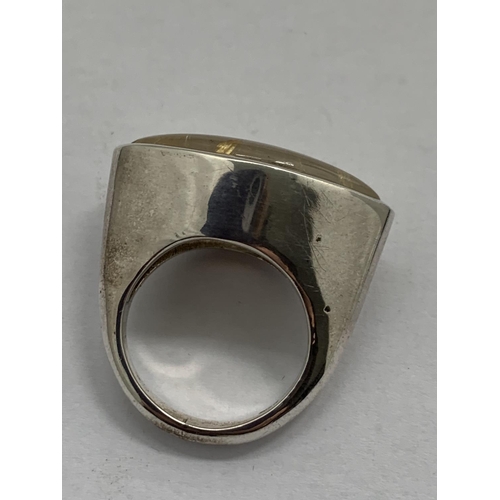 612 - A BOXED WHITE METAL RING WITH STONE