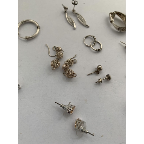 616 - TWELVE PAIRS OF SILVER EARRINGS