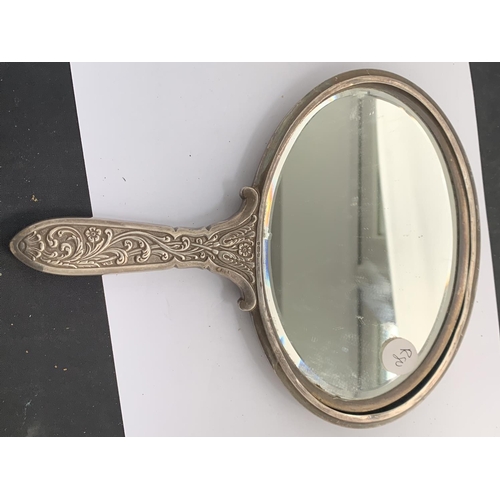 621 - AN EDWARDIAN CONTINENTAL SILVER OVAL EMBOSSED HAND MIRROR