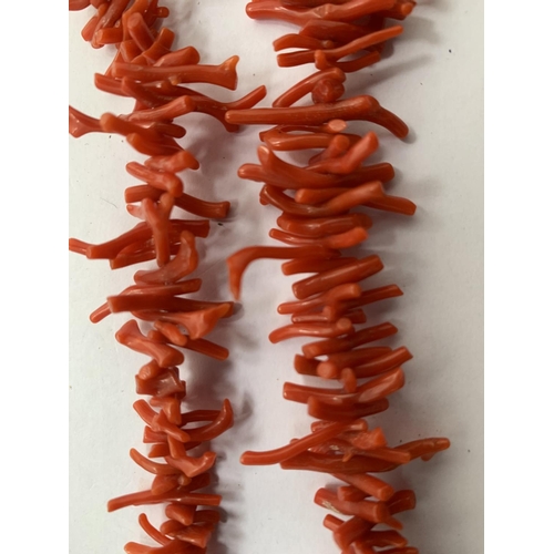 623 - TWO SINGLE STRAND CORAL TEETH SHAPED BEADS AND A MATCHING BRACELET