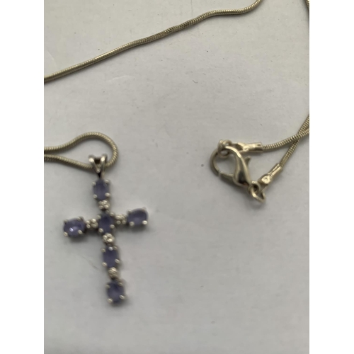 626 - A 9CT WHITE GOLD TANZANITE AND DIAMOND CROSS PENDANT WITH A WHITE METAL CHAIN (UNMARKED), APPROX TOT... 