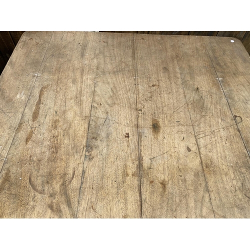 2134 - AN EARLY 20TH CENTURY SCRUB TOP WIND OUT  KITCHEN TABLE