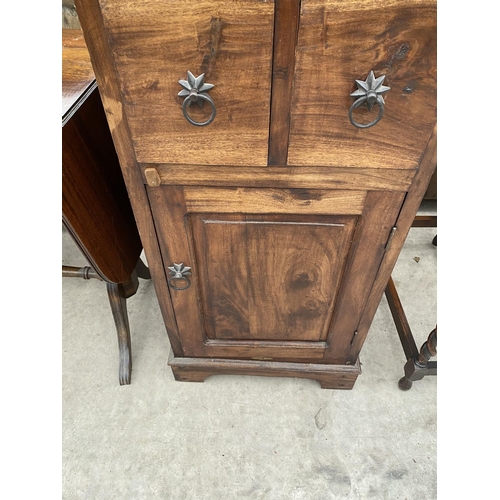 2136 - A MODERN INDONESIAN WOOD DOME TOPPED CHEST WITH TWO DOORS AND FOUR DRAWERS