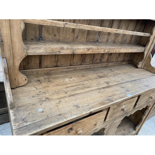 2146 - A LARGE VICTORIAN STYLE PINE DRESSER WITH OPEN BASE, THREE DRAWERS AND UPPER PLATE RACK