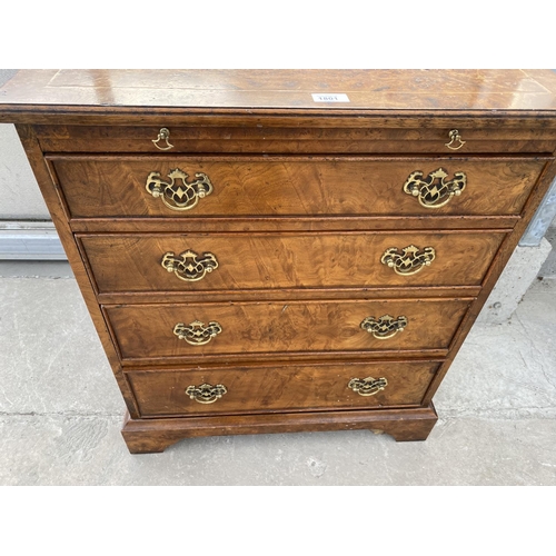 1801 - A REPRODUCTION BURR WALNUT CHEST OF FOUR GRADUATED DRAWERS WITH DRESSING SLIDE, 26