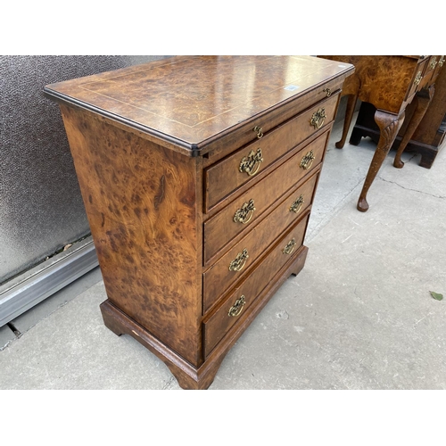 1801 - A REPRODUCTION BURR WALNUT CHEST OF FOUR GRADUATED DRAWERS WITH DRESSING SLIDE, 26