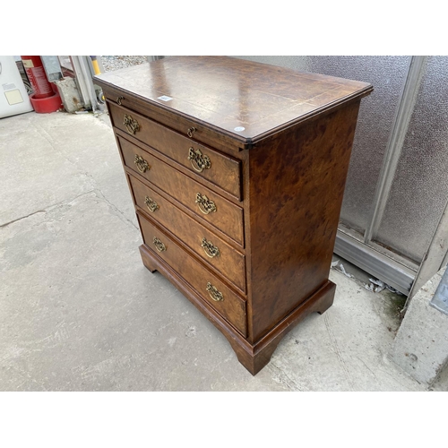 1801 - A REPRODUCTION BURR WALNUT CHEST OF FOUR GRADUATED DRAWERS WITH DRESSING SLIDE, 26