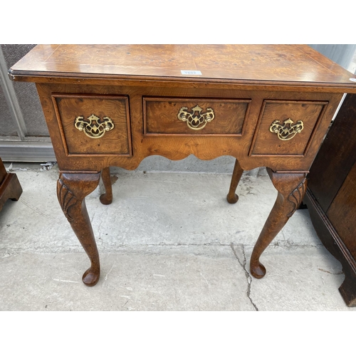 1802 - A REPRODUCTION BURR WALNUT LOW BOY OF THREE DRAWERS ON CABRIOLE LEGS, 27