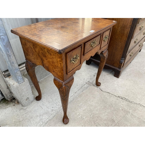 1802 - A REPRODUCTION BURR WALNUT LOW BOY OF THREE DRAWERS ON CABRIOLE LEGS, 27