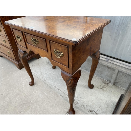 1802 - A REPRODUCTION BURR WALNUT LOW BOY OF THREE DRAWERS ON CABRIOLE LEGS, 27