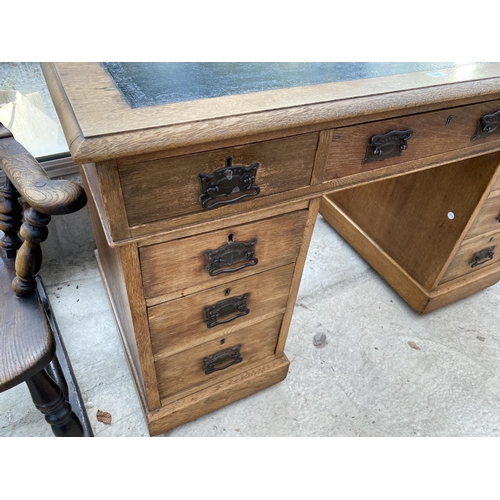 1807 - AN EDWARDIAN OAK TWIN-PEDESTAL DESK WITH INSET LEATHER TOP, 48x23