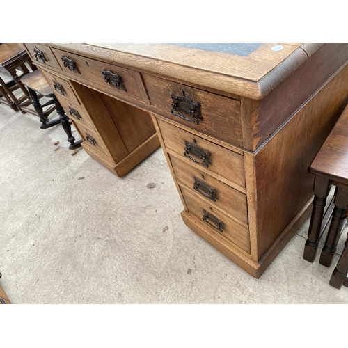 1807 - AN EDWARDIAN OAK TWIN-PEDESTAL DESK WITH INSET LEATHER TOP, 48x23