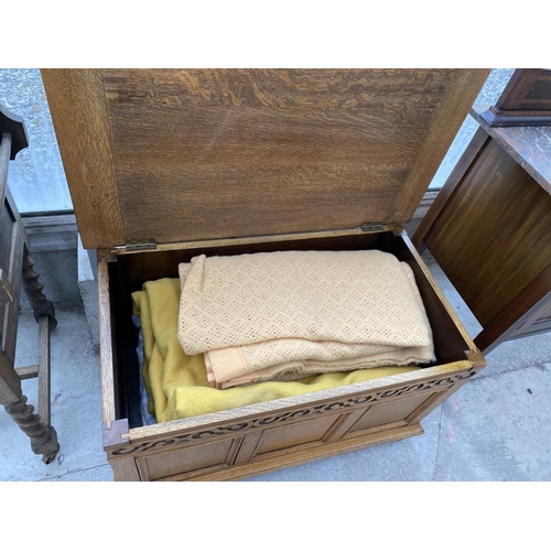 1810 - A SMALL REPRODUCTION BLANKET CHEST WITH THREE PANEL FRONT AND CARVED FRIEZE, 33