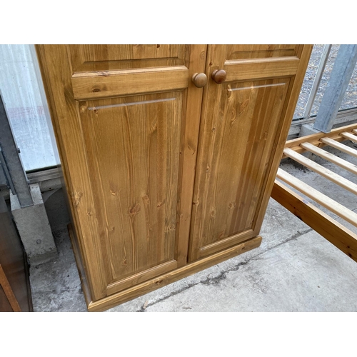 1819 - A MODERN PINE TWO DOOR PANELLED WARDROBE, 35