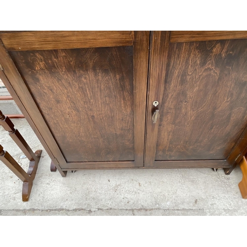 1828A - AN OAK TWO DOOR CABINET