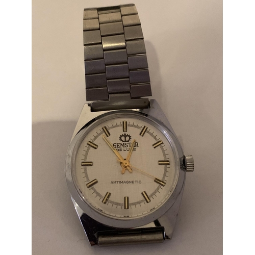 511 - A GEM STAR DE LUX WRIST WATCH IN WORKING ORDER