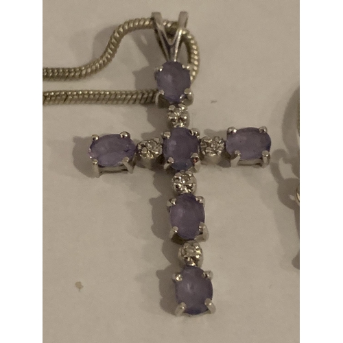 521 - A 9CT WHITE GOLD TANZANITE AND DIAMOND CROSS PENDANT WITH A WHITE METAL CHAIN (UNMARKED), APPROX TOT... 