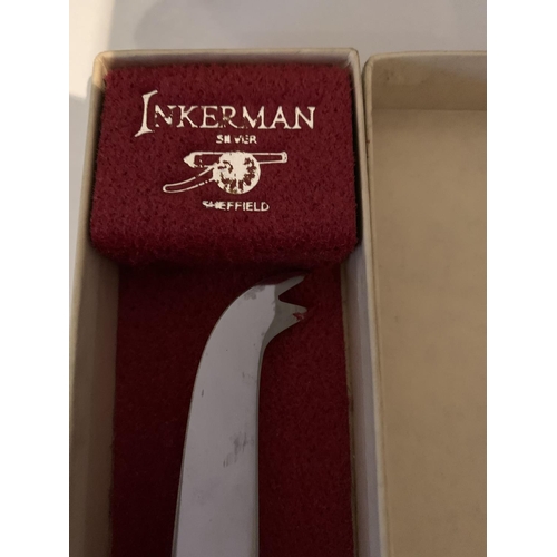 522 - A BOXED SILVER PLATED CHEESE KNIFE