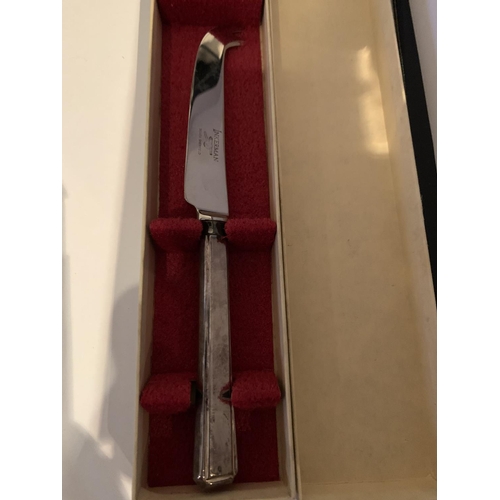 522 - A BOXED SILVER PLATED CHEESE KNIFE