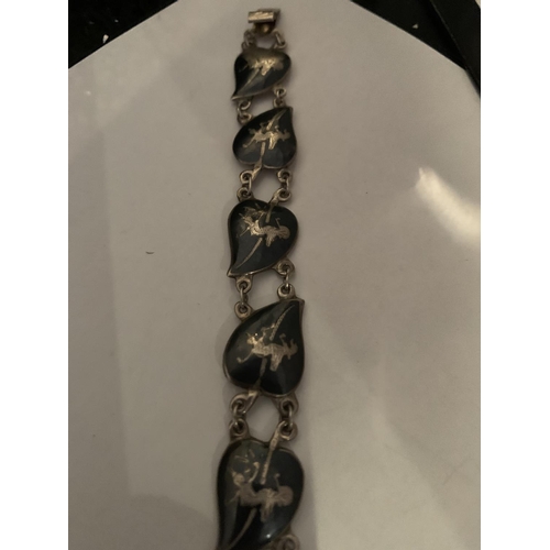 525 - A SIAM SILVER MARKED BRACELET AND MATCHING CLIP ON EARRINGS, APPROX TOTAL GROSS WEIGHT 24 GRAMS