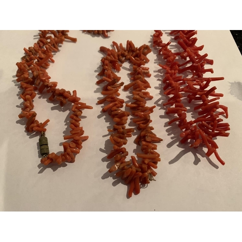 534 - TWO SINGLE STRAND CORAL TEETH SHAPED BEADS AND A MATCHING BRACELET