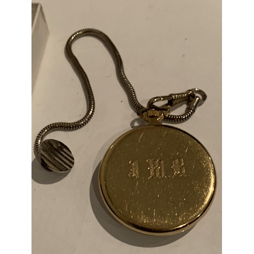 553 - A GOLD PLATED POCKET WATCH AND CHAIN IN WORKING ORDER