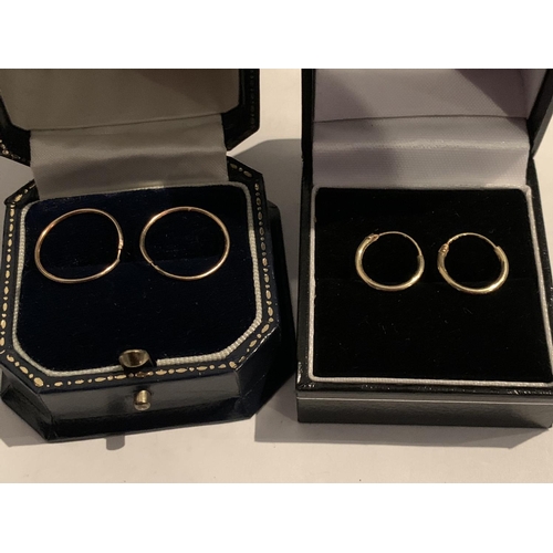 559 - A BOXED PAIR OF 9 CARAT GOLD SLEEPER EARRINGS AND A FURTHER PAIR POSSIBLY GOLD