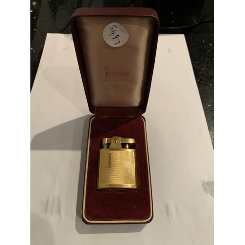 564 - A BOXED YELLOW METAL RONSON LIGHTER