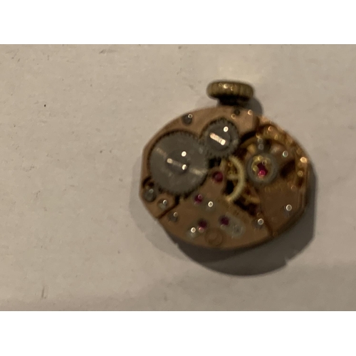 572 - A LADIES WRIST WATCH MOVEMENT (BELIEVED ROLEX), A PLATINUM WATCH CLASP AND A WATCH CLASP MARKED ETER... 