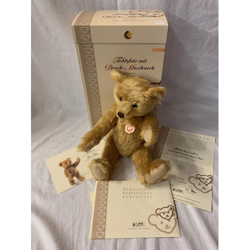 330 - A STEIFF TEDDY BEAR WITH A PRESS AND LISTEN MUSIC BOX WITH BOX AND CERTIFICATE