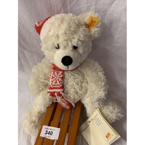 340 - A WHITE STEIFF BEAR ON A SLEDGE