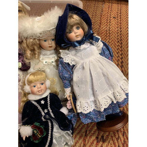 379 - A GROUP OF FIVE PORCELAIN HEADED DOLLS