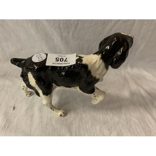 705 - A BESWICK BLACK AND WHITE SPANIEL