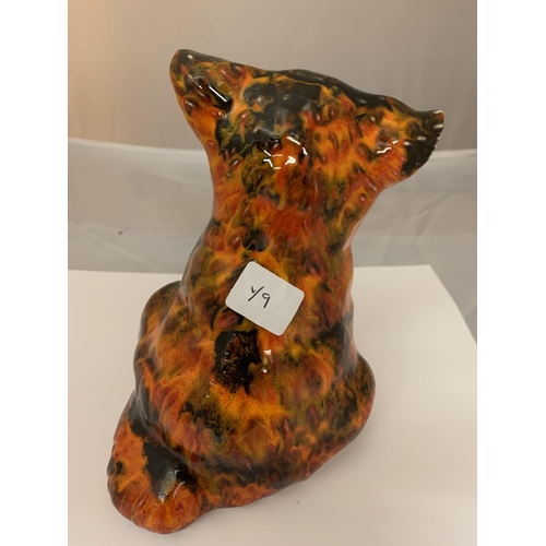 731 - AN ANITA HARRIS SIGNED AND HANDPAINTED  MODEL OF A SITTING DOG