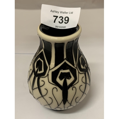 739 - A MOORCROFT PEACOCK PARADE BLACK AND WHITE VASE