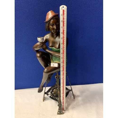 1 - A BRONZE FIGURINE OF A SEMI-NUDE POSED ON A TALL STOOL IN AN ART DECO STYLE