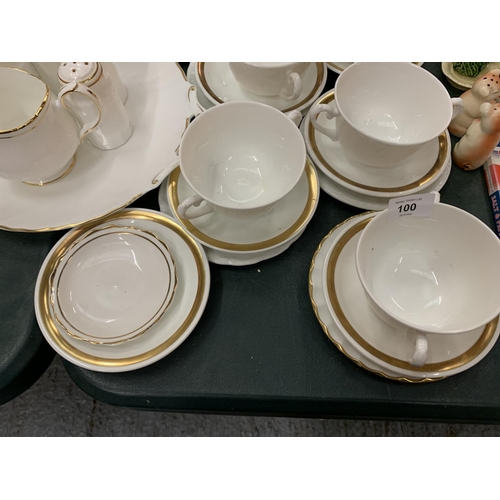 100 - AN ASSORTMENT OF WHITE DINNER WARE WITH GOLD DETAIL