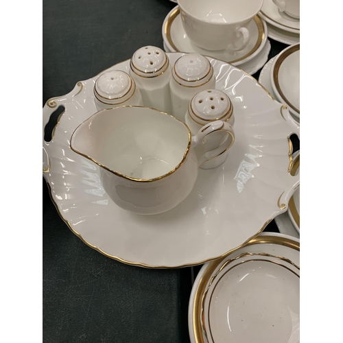 100 - AN ASSORTMENT OF WHITE DINNER WARE WITH GOLD DETAIL