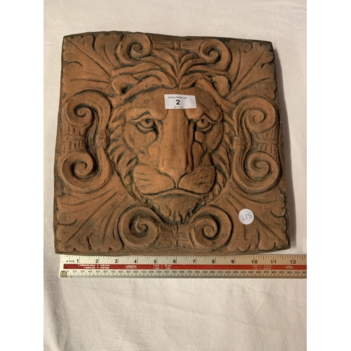 2 - A TERRACOTTA TILE DEPICTING A LION'S FACE